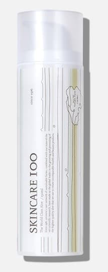 기존 스킨케어100 용기 — 흰 반투명 펌프 용기에 세로 글자 SKINCARE 100
